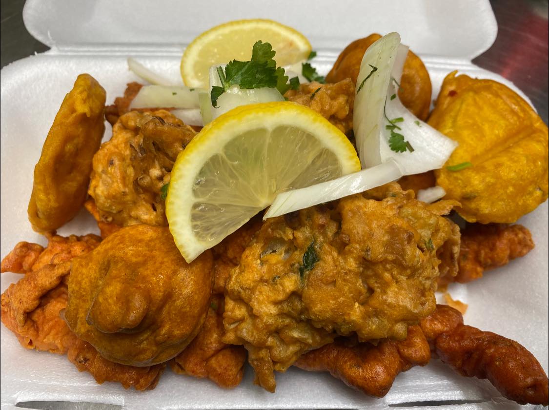Pakoras with onion and lemon served at Shaban's Renfrew Takeaway