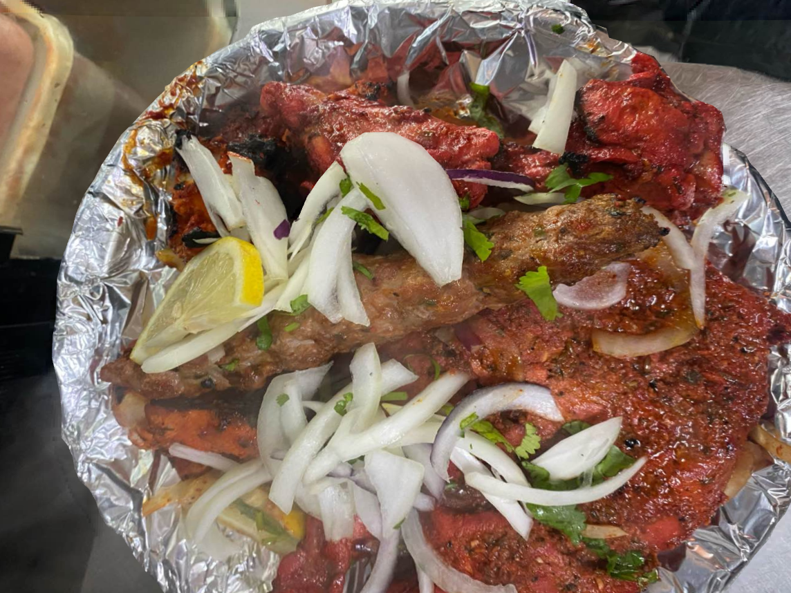Tandoori lamb grilled with onion and lemon in a dish served at Shaban's Renfrew Takeaway